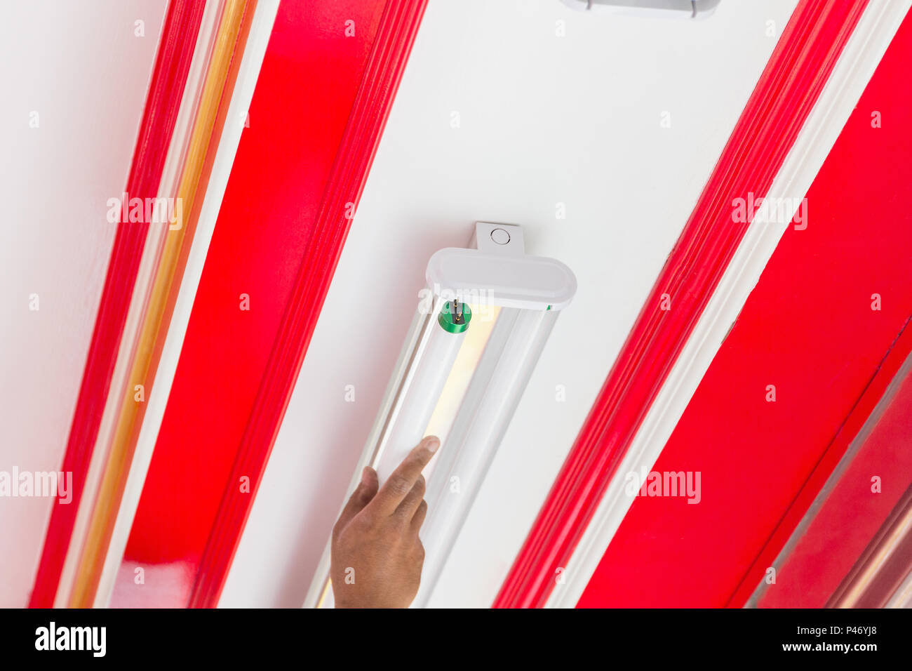 Setup fluorescent light green power on ceiling, selection focus, copy space background. Stock Photo