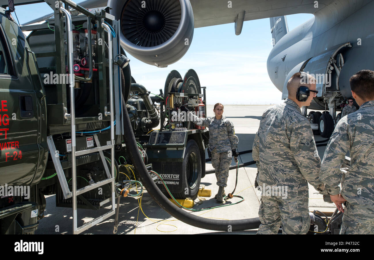 Airman First Class Melanie Candelaria, fuels distribution operator, 60th Logistic Readiness Squadron, services a C-5 Super Galaxy at Travis AFB, June 10, 2016. The job of the fuels management flight is essential to the mission to provide combat ready airpower and Airmen to meet any challenge, anytime, anywhere.(U.S. Air Force Photo by Heide Couch) Stock Photo