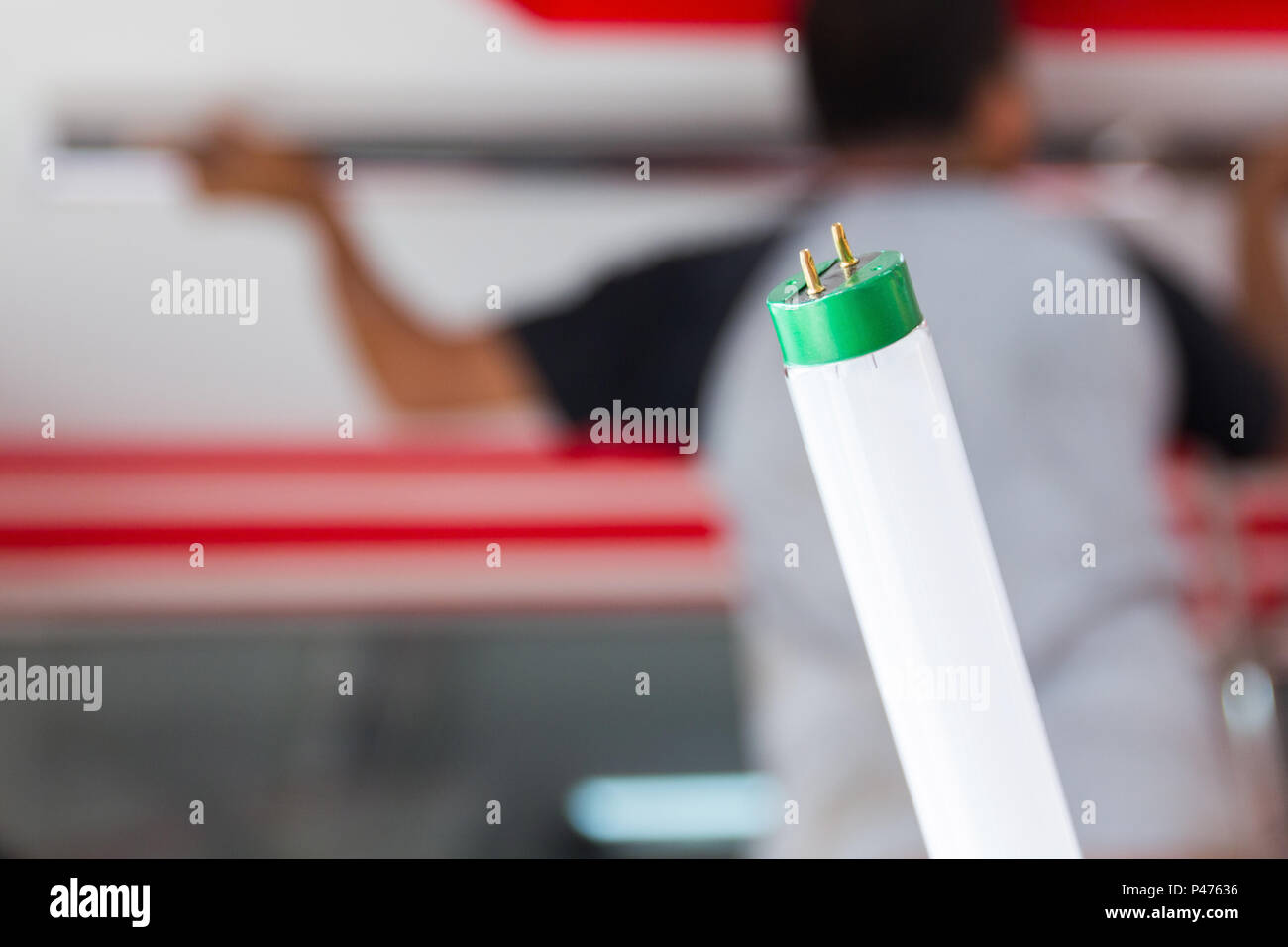 Setup fluorescent light green power on ceiling, selection focus, copy space background. Stock Photo