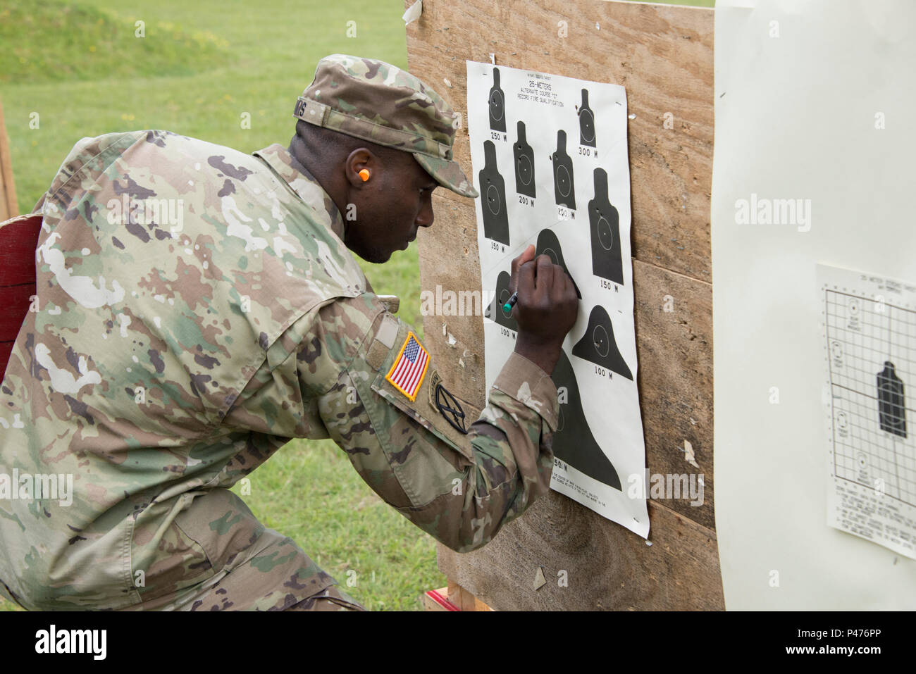 U.S. Army Sgt. Damarcus Davis supports the competition during the Joint Multinational Training Command Best Warrior Competition at Grafenwoehr Training Area, Germany, June 21, 2016. The four-day competition challenges soldier and noncommissioned officers all of who have previously competed to be named the best in their units, to prove their skills in military knowledge, leadership, and endurance in the warrior task and drills critical to success and survival on the modern battlefield. (U.S. Army Photo by Visual Information Specialist Gerhard Seuffert/released) Stock Photo