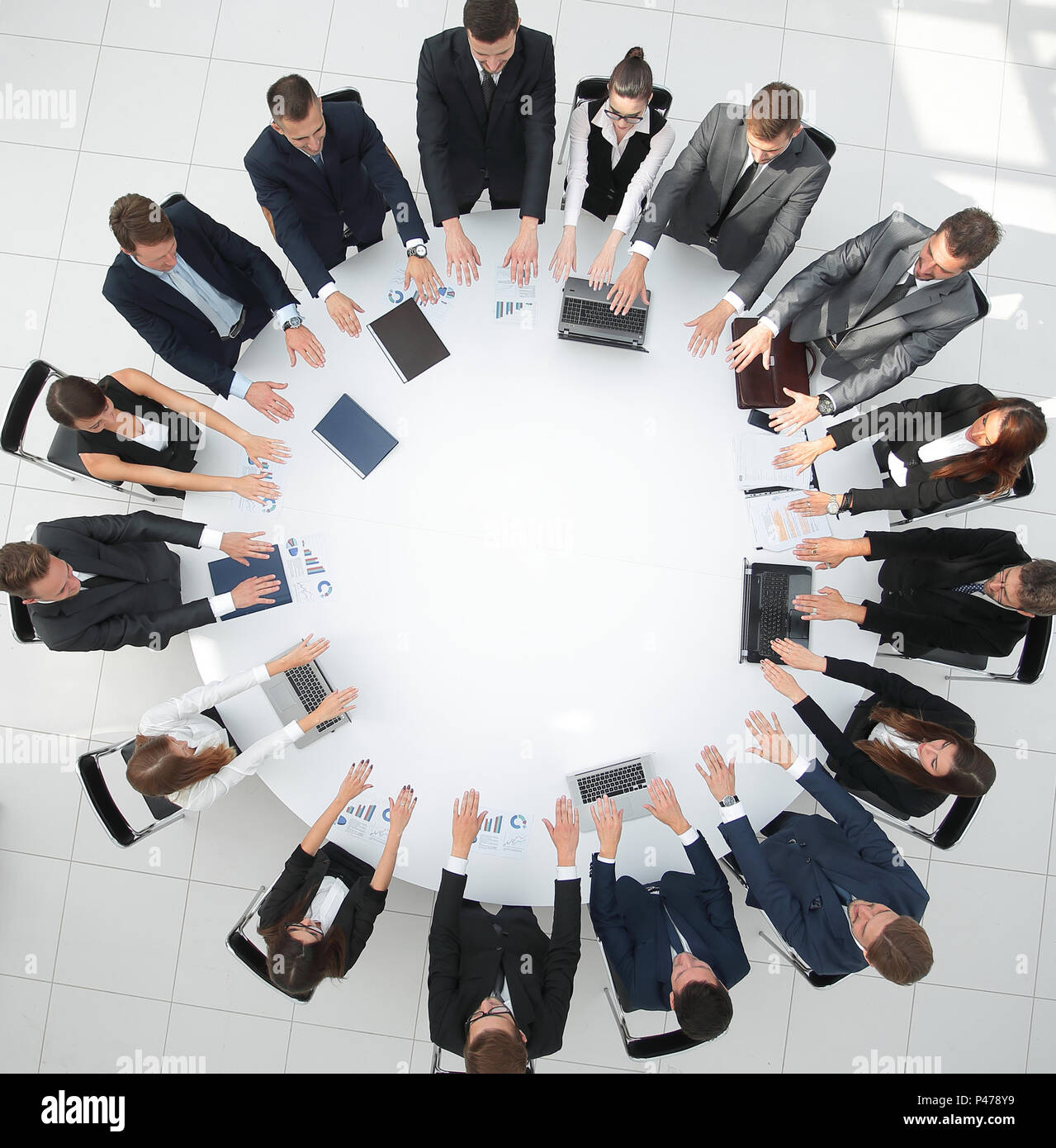 Group Of Business People Sitting At The Round Table