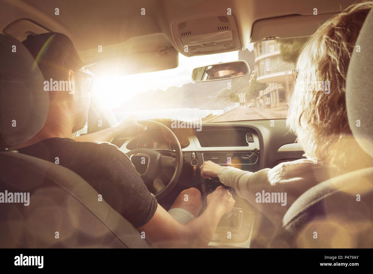 Young couple driving in a car Stock Photo