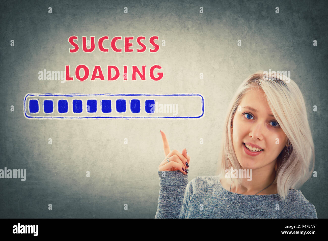 Businesswoman, with a happy emotion, showing with her hand to a loading ...