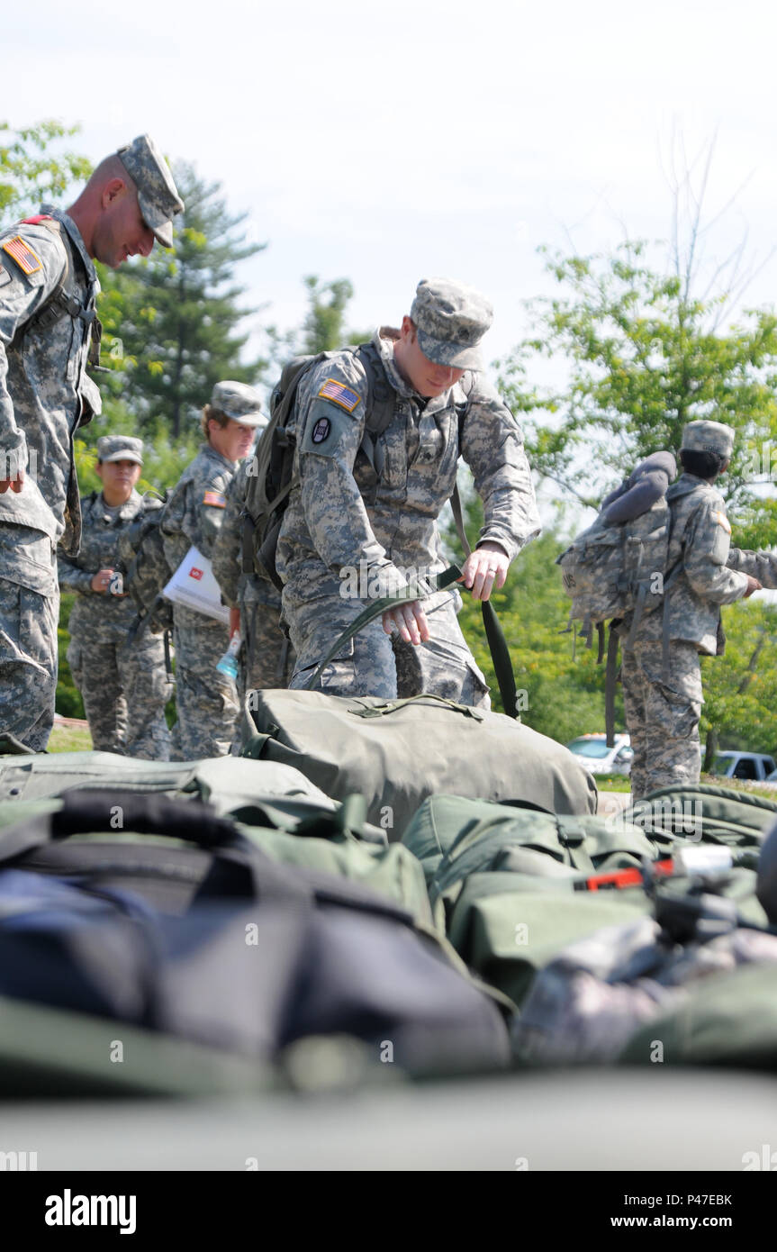 North Carolina Army National Guard soldiers assigned to the 630th Combat Sustainment Support Battalion neatly stage their luggage in front of the Lenoir National Guard armory while waiting to be transported to the National Training Center in Fort Irwin, California from Lenoir, North Carolina on June 4, 2016. The NTC is a training facility designed to simulate real-life combat scenarios testing warriors’ readiness utilizing their military occupational specialty in a high-up-tempo environment.  (U.S. Army National Guard photo by Sgt. Leticia Samuels, 382nd Public Affairs Detachment/Released) Stock Photo