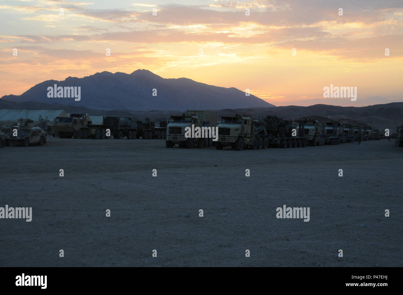 Soldiers assigned to the 630th Combat Sustainment Support Battalion wait for the ‘go ahead’ prior to tactically moving to the Rotational Unit Bivouac Area (RUBA) using convoy operations at Fort Irwin, California during the 16-07 National Training Center rotation on June 22, 2016. The 630th CSSB moved over 300 pieces of equipment and over 400 personnel while conducting logistics operations at the NTC, which is a training facility designed to simulate real-life combat scenarios testing warriors’ readiness utilizing their military occupational specialty in a high-up-tempo environment.  (U.S. Army Stock Photo