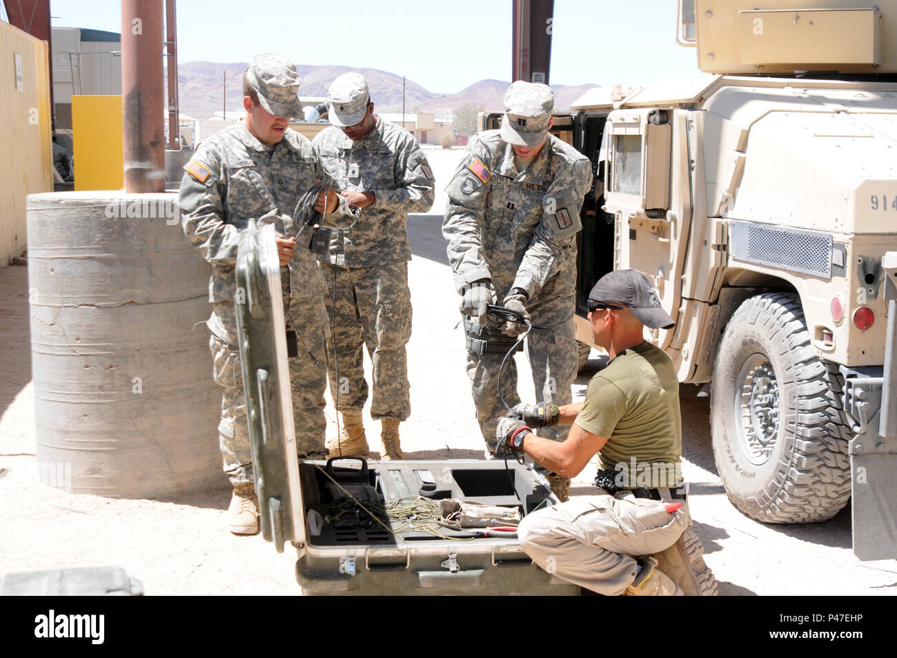 North Carolina Army National Guard soldiers assigned to the 630th Combat Sustainment Support Battalion, turn in Multiple Integrated Laser Engagement Systems (MILES) at the Rotational Unit Bivouac Area during the 16-07 National Training Center rotation at Fort Irwin, California on June 22, 2016. MILES are mounted onto military vehicles and personnel providing a realistic battlefield environment by simulating damage sustained to personnel and vehicles during force-on-force training exercises to enhance soldiers’ individual and collective training.   The NTC is a training facility designed to sim Stock Photo