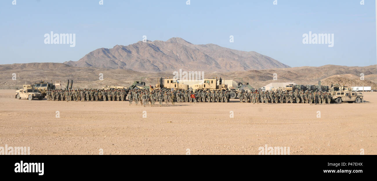 Over 450 soldiers assigned to the 630th Combat Sustainment Support Battalion, stand in formation after completing over 75 convoy missions in a 14-day period at the Logistics Support Area Forward Operating Base Santa Fe, Fort Irwin, California during the 16-07 National Training Center rotation at on June 21, 2016.  The NTC is a training facility designed to simulate real-life combat scenarios testing warriors’ readiness utilizing their military occupational specialty in a high-up-tempo environment.  (U.S. Army National Guard photo by Sgt. Leticia Samuels, 382nd Public Affairs Detachment/Release Stock Photo