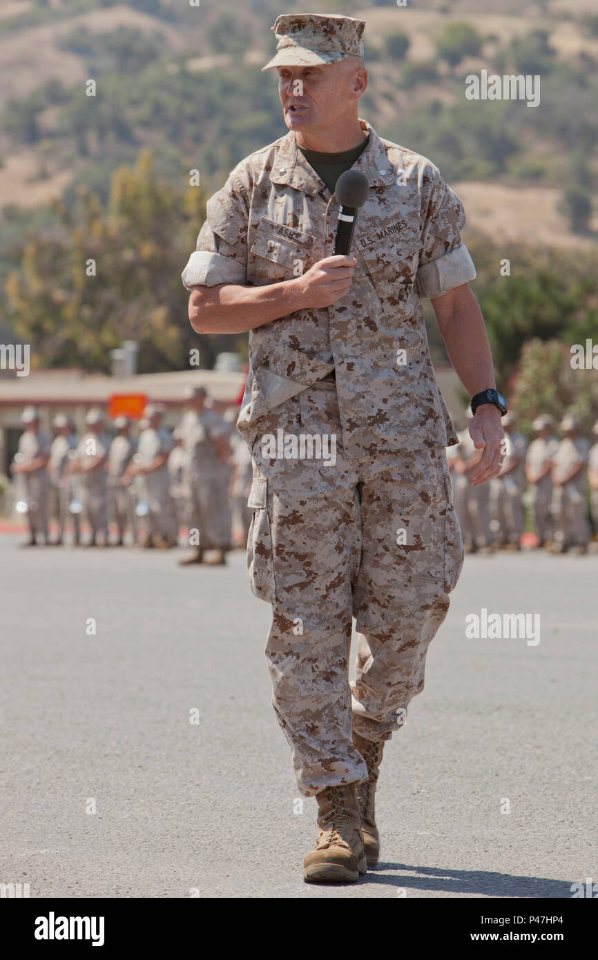 U.S. Marine Corps Lt. Col. Phillip N. Ash, Commanding Officer, Marine Combat Training Battalion, School of Infantry-West, addresses the audience during a Change of Command Ceremony at Camp Pendleton, Calif., June 22, 2016.  A Change of Command is a military tradition that represents a formal transfer of authority and responsibility for a unit from one Commanding Officer to another. (U.S. Marine Corps photo by Lance Cpl. Brandon Martinez, MCIWEST-MCB CamPen Combat Camera/Released) Stock Photo