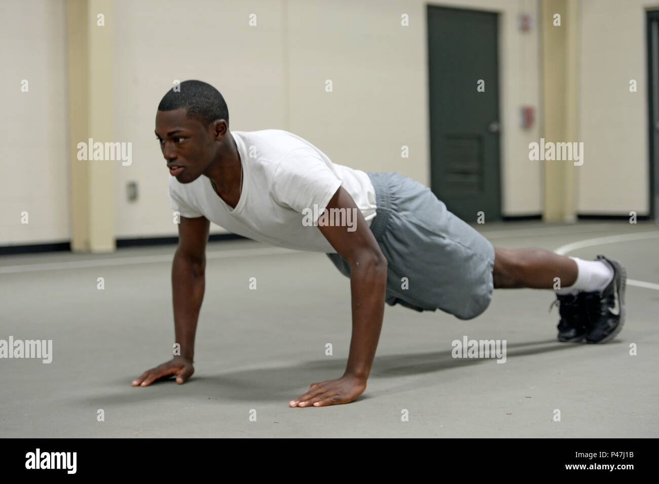 Cadet Malcolm Davis performs push ups during his last physical fitness test  at the Texas ChalleNGe Academy-East June 17, 2016, in Eagle, Texas. Davis  is one of 49 TCA cadets who graduted