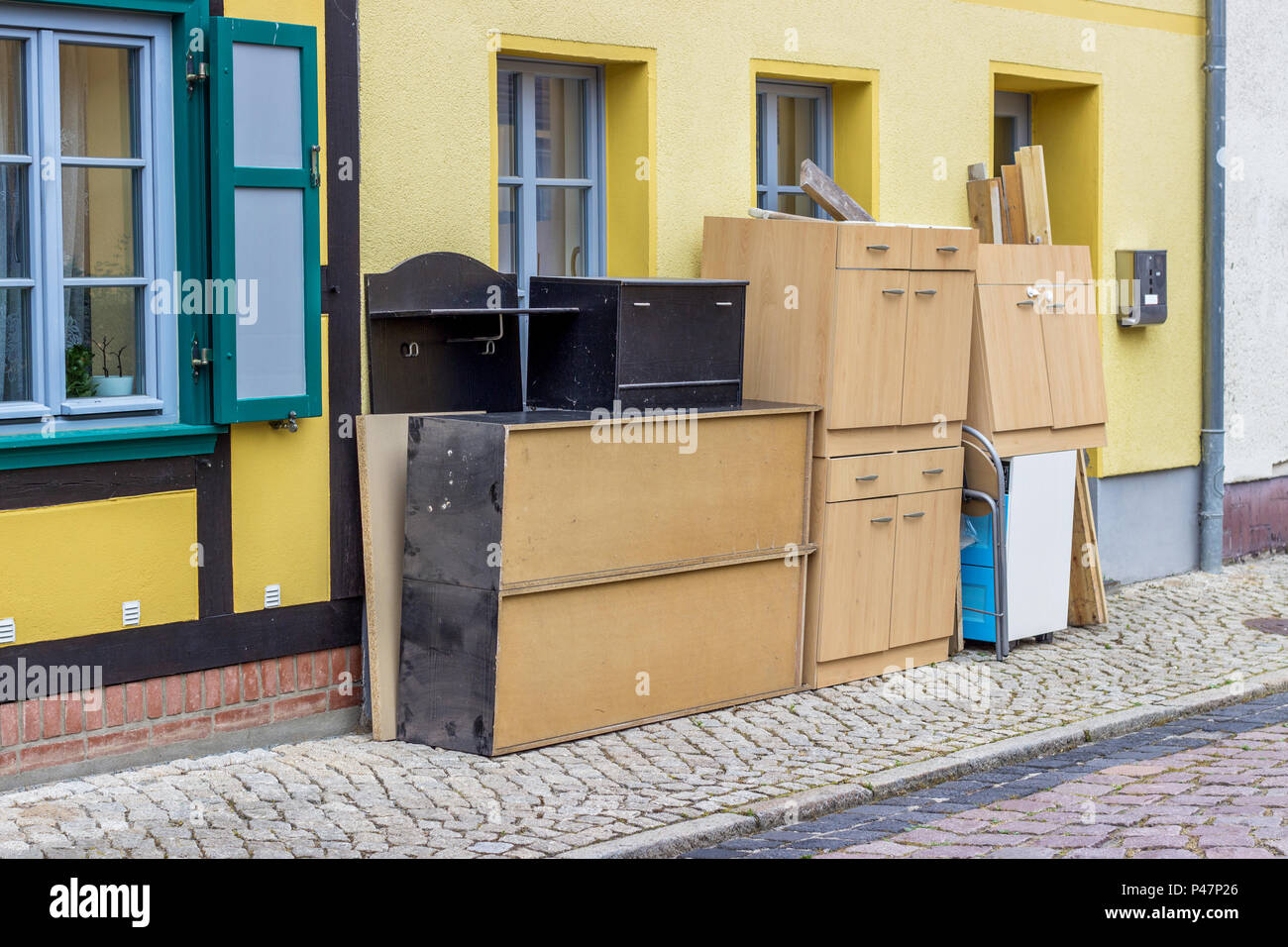 old furniture and household goods on the roadside Stock Photo Alamy