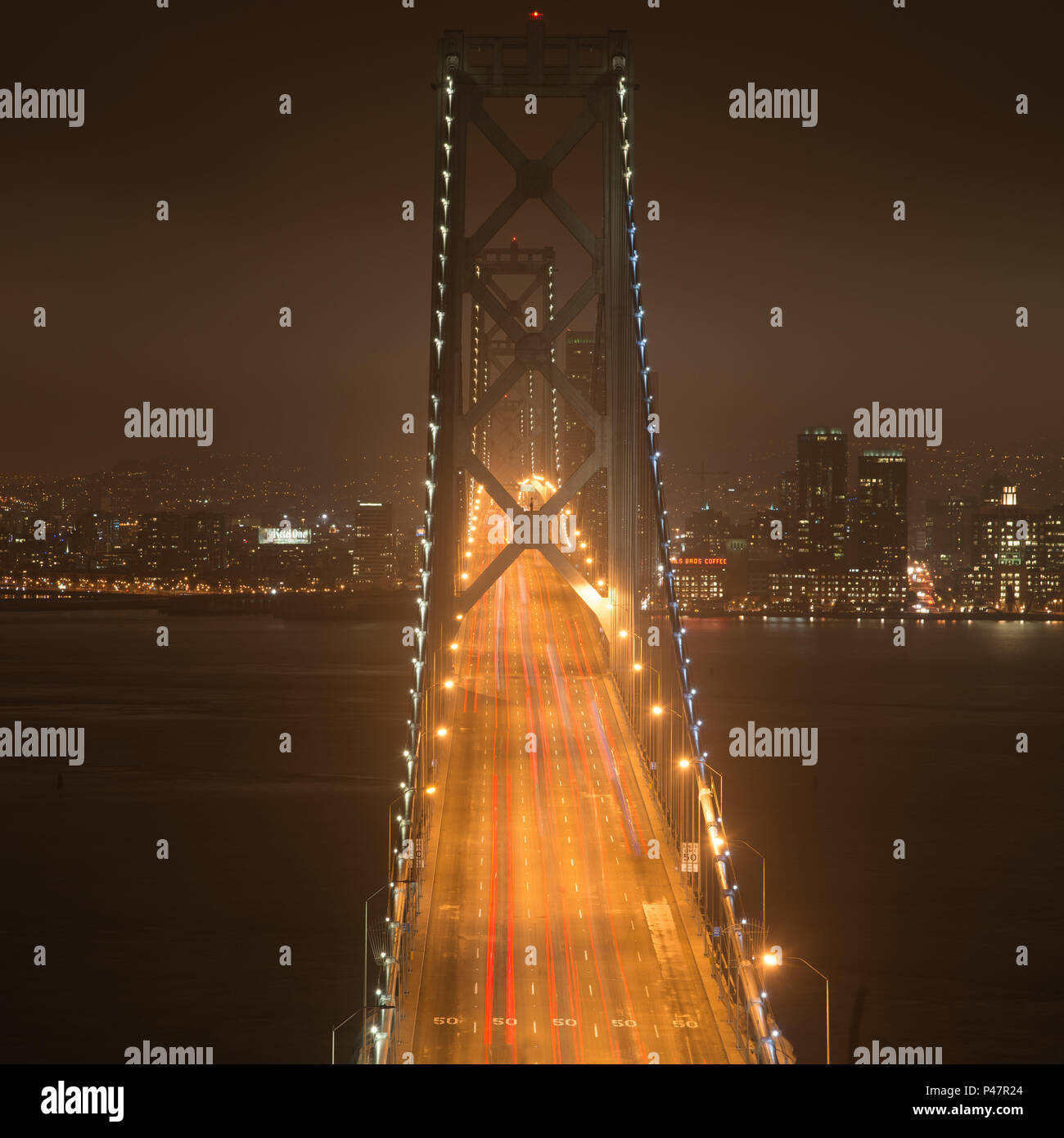 Elevated view of the Bay Bridge lit up at night, San Francisco, North Beach, California, USA Stock Photo