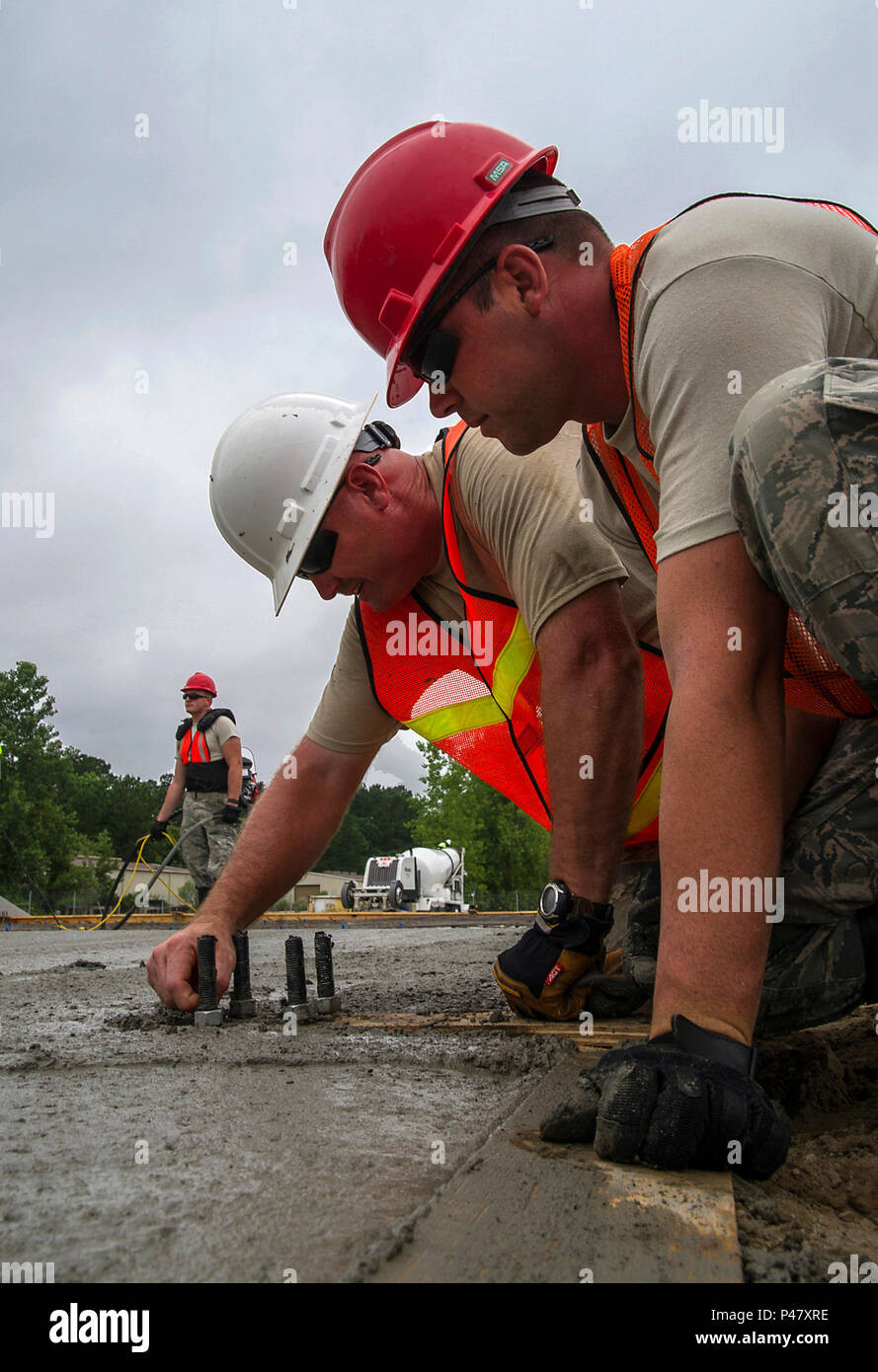 (White hat) Master Sgt. Thomas Martin, 556th RED HORSE Squadron from ...