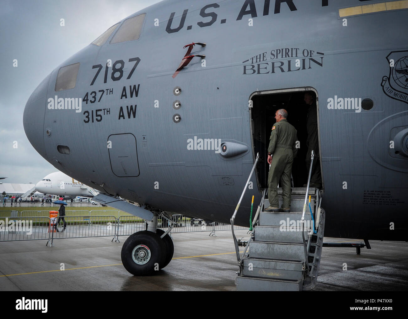 Lt. Col. Craig Bartosh, 701st Airlift Squadron aircraft commander, boards The Spirit of Berlin C-17 Globemaster III at the 2016 Berlin Airshow earlier this month in June to help prepare the Charleston jet for the day's visitors. Approximately 230,000 visitors and exhibitors from more than 65 countries attended the show. (U.S. Air Force photo by Senior Airman Tom Brading) Stock Photo