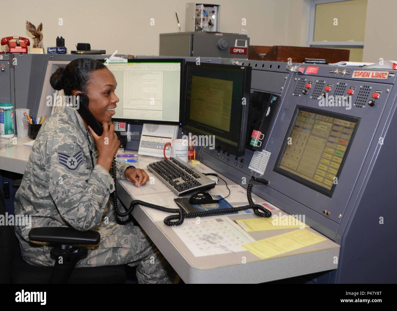 Staff Sgt. Shantel Ellis, 507th Air Refueling Wing command post controller coordinates with maintenance during the June Operational Exercise at Tinker Air Force Base, Okla. June 2, 2016. Command post controllers along with maintenance professionals in the maintenance operations control center were tested by running numerous checklists, relaying command information, tracking aircraft, answering radio and phone calls while dispatching crews. (U.S. Air Force Photo/Tech Sgt. Lauren Gleason)      Senior Airman Nathalie Hamilton and Jose Gonzales, both crew chiefs with the 507th Aircraft Maintenance Stock Photo