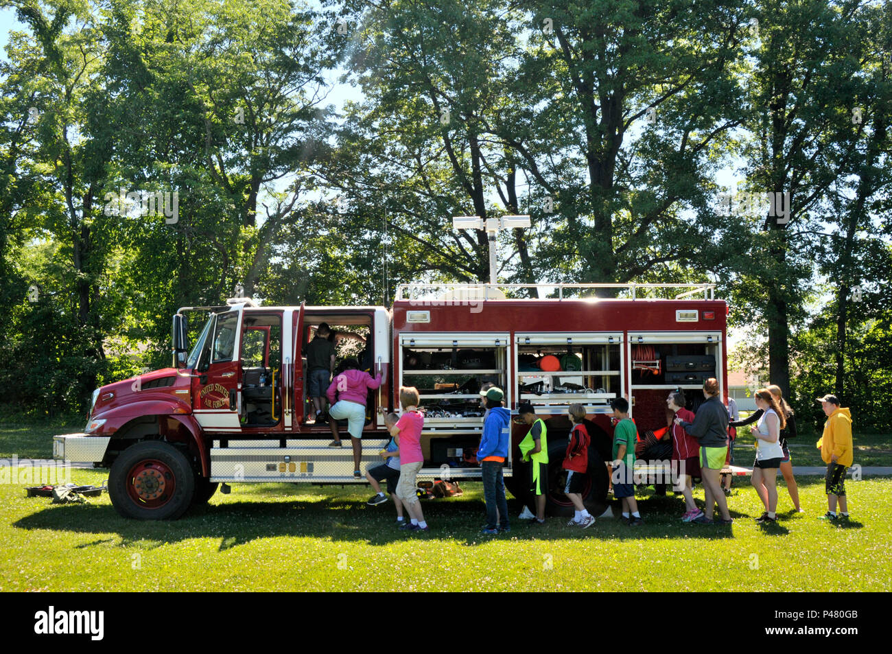The 122nd Fighter Wing Fire Squadron opened up the doors to it's fire trucks for the campers at Red Cedar during a fire safety presentation June 29, 2016 at Camp Red Cedar, Fort Wayne, In. Camp Red Cedar is a theraputic camp for children and young adults that live with autism. The 122nd Fire Squadron regularly gives safety presentations for area organizations. (U.S.Air National Guard photo by Staff Sgt. Rana Franklin/released) Stock Photo