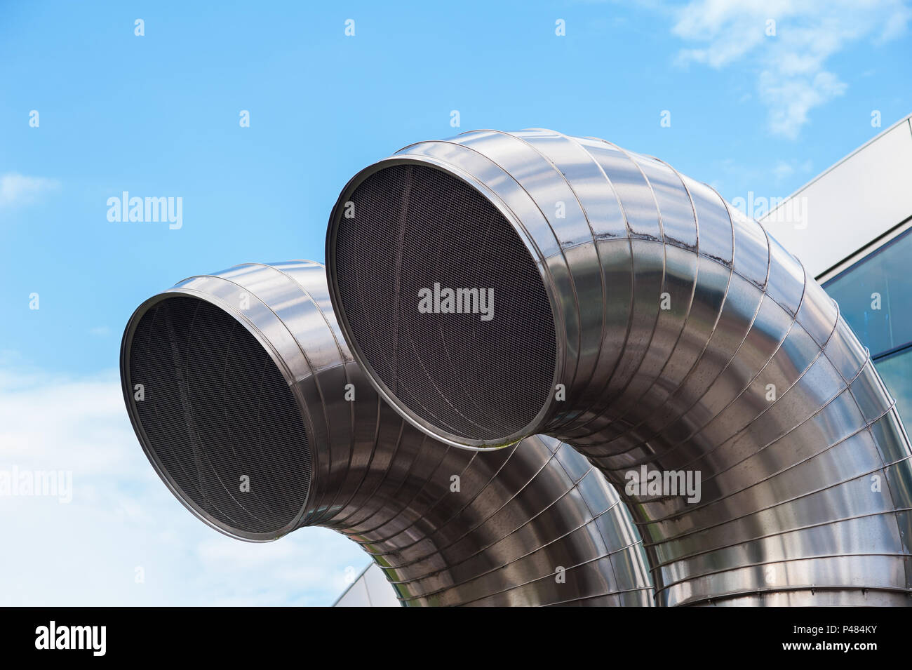 Stainless steel pipes. Air exchange ducts, underground constructions. Parking lots, underground warehouses. Stock Photo