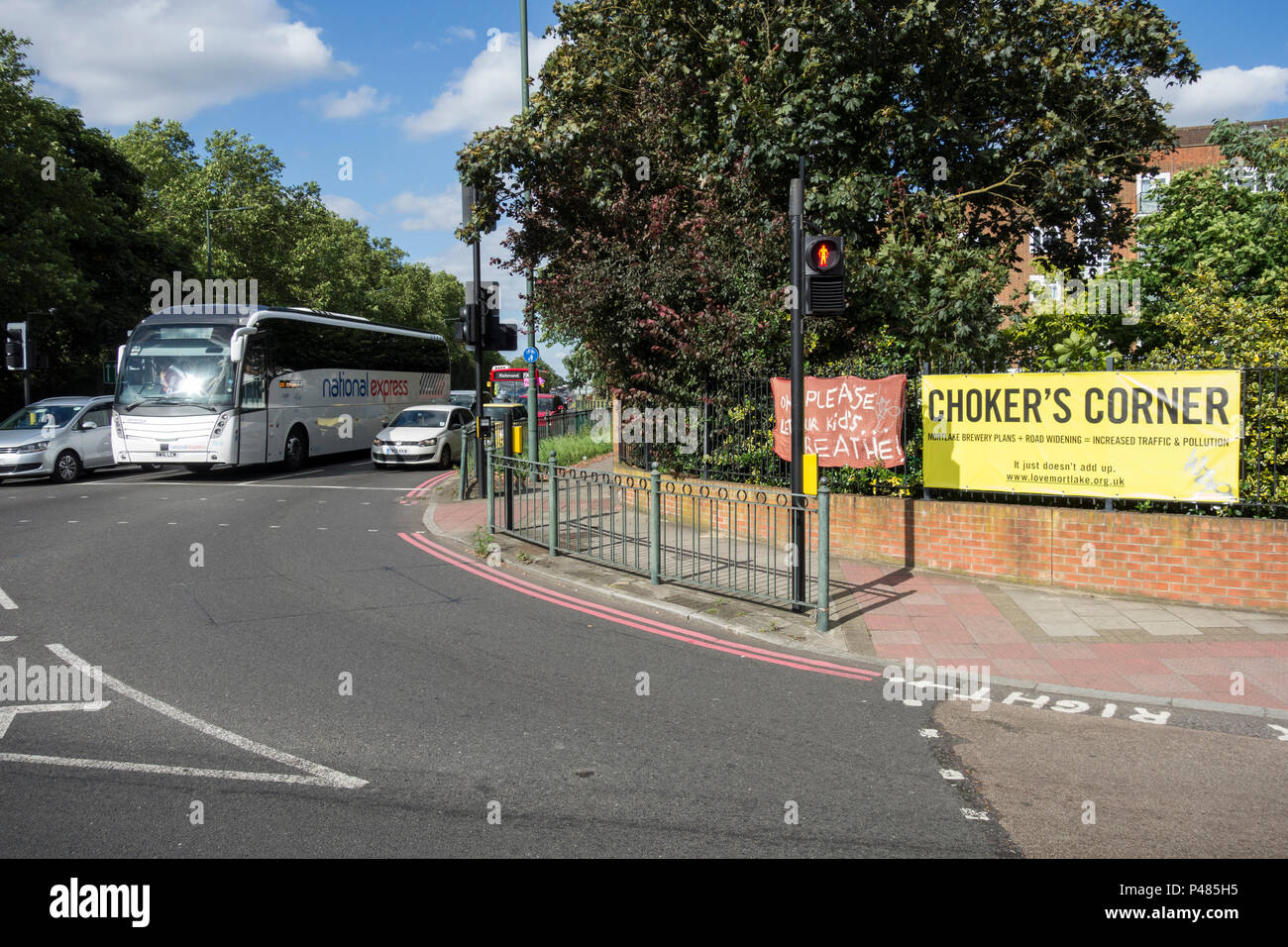 Rush hour traffic waiting at the busy and congested Chalkers' Corner, Mortlake, London, SW14, UK Stock Photo