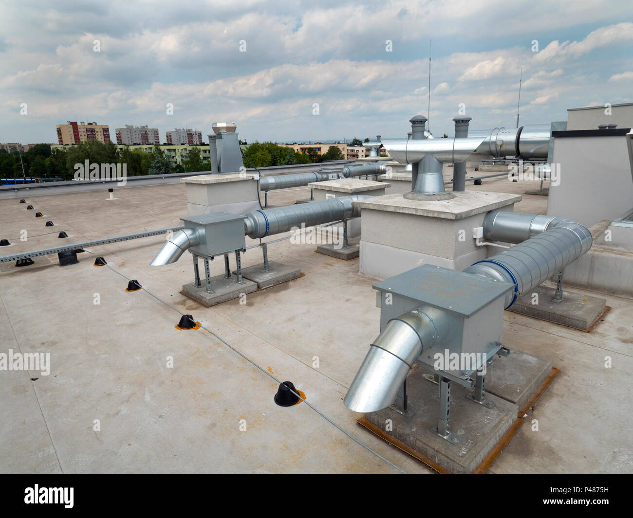 Elements of ventilation and air conditioning placed on the roof of a