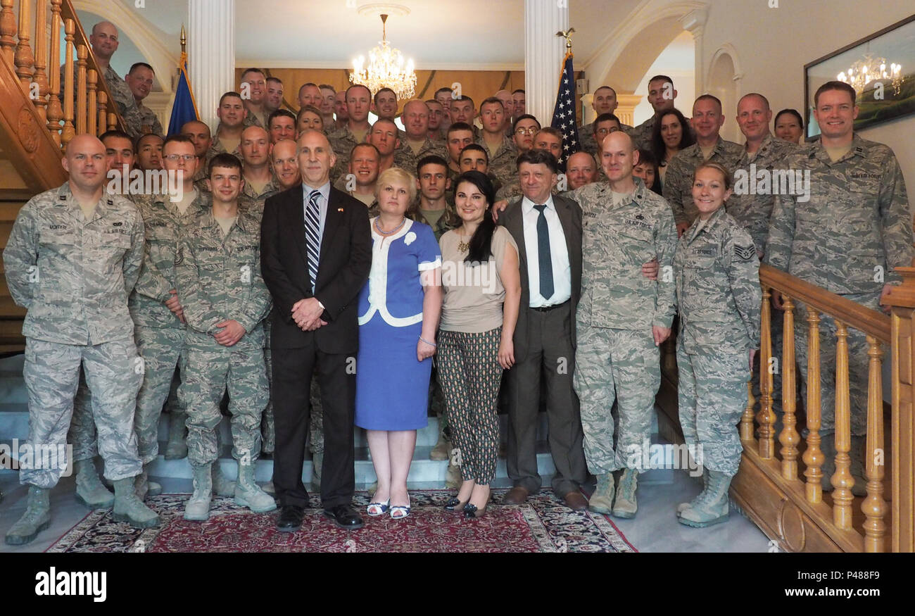 James Pettit (center), U.S. Ambassador to the Republic of Moldova, U.S. Airmen, assigned to the 185th Civil Engineering Squadron, Iowa Air National Guard, U.S. Soldiers, assigned to the 457th Civil Affairs Battalion, 361st Civil Affairs Brigade, 7th Mission Support Command and Moldovan Explosive Ordnance Disposal (EOD) engineers pose for a photo, in Chisinau, Moldova, June 17, 2016. As part of the European Command’s (EUCOM) Humanitarian and Civic Assistance Program, the 123rd Civil Engineering Squadron from the Kentucky Air National Guard, 185th Engineering Squadron from the Iowa Air National  Stock Photo