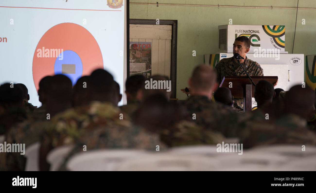 Sgt. Alexander Rockman, military policeman with 4th Law Enforcement Battalion, teaches a search and cordon class during Exercise Tradewinds 2016, at Moneague Training Camp, Jamaica, June 21, 2016. Tradewinds is designed for partner nations to conduct joint, combined and interagency capacity building that focuses on increasing regional cooperation in complex multinational security operations and humanitarian assistance. (U.S. Marine Corps photo by Cpl. Justin T. Updegraff/ Released) Stock Photo