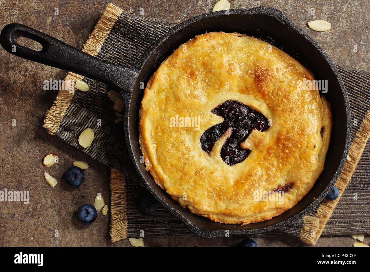 Pi Day special homemade blueberry pie baked in a skillet overhead view Stock Photo
