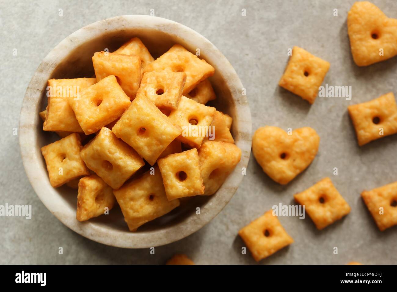 Homemade square Cheese Crackers in a bowl Stock Photo Alamy