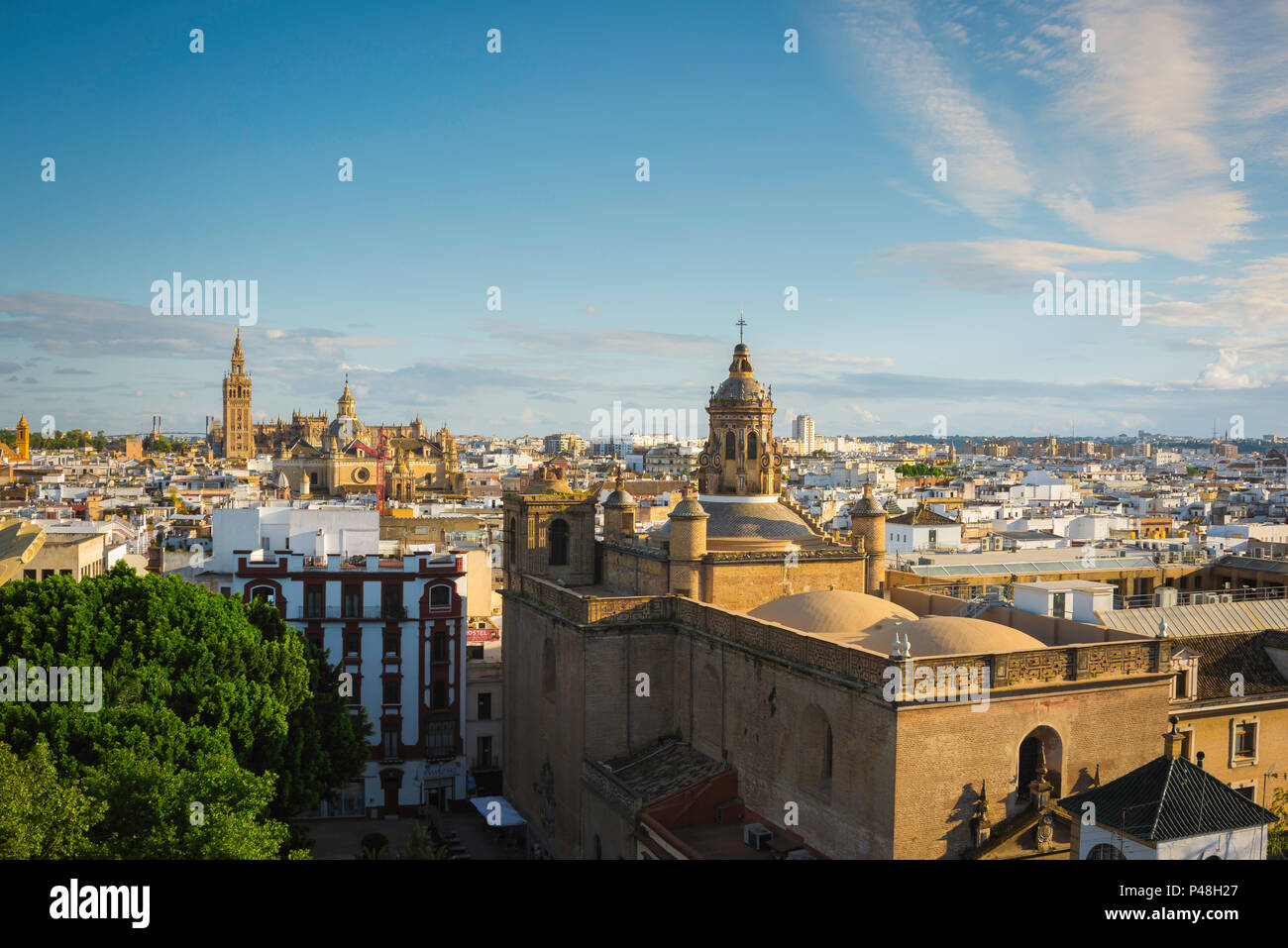 Seville Spain cityscape, view across the old city quarter of Seville at sunset towards the Cathedral and La Giralda tower, Andalucia, Spain. Stock Photo