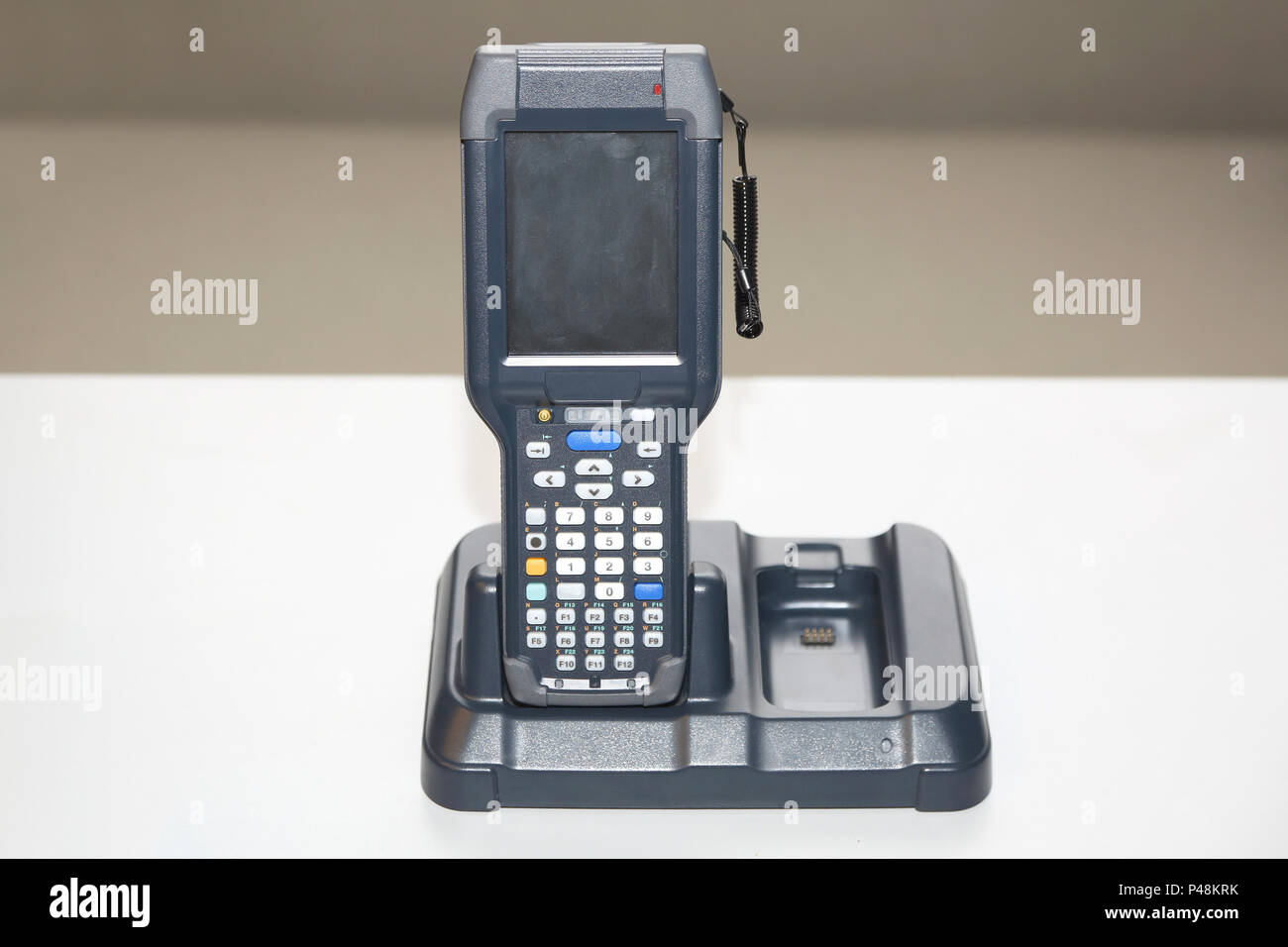 Handheld Laser Barcode Scanner Computer at Charger Dock Stock Photo Alamy
