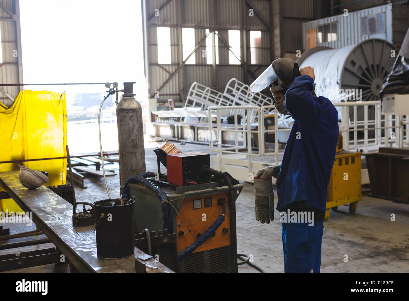 Man wearing welding helmet welding hires stock photography and images