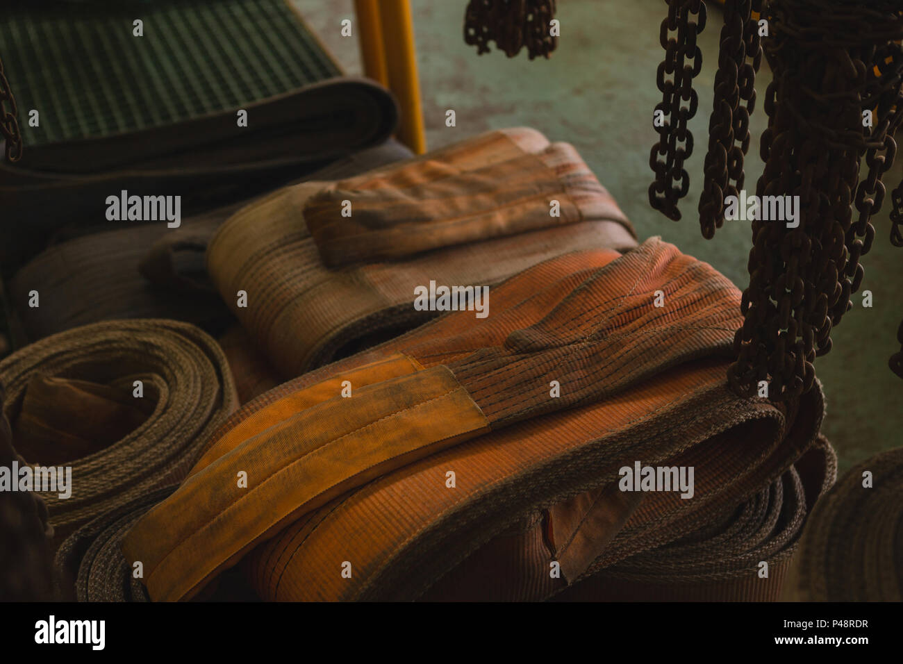 Rubber belts and rustic chain in storage compartment Stock Photo Alamy