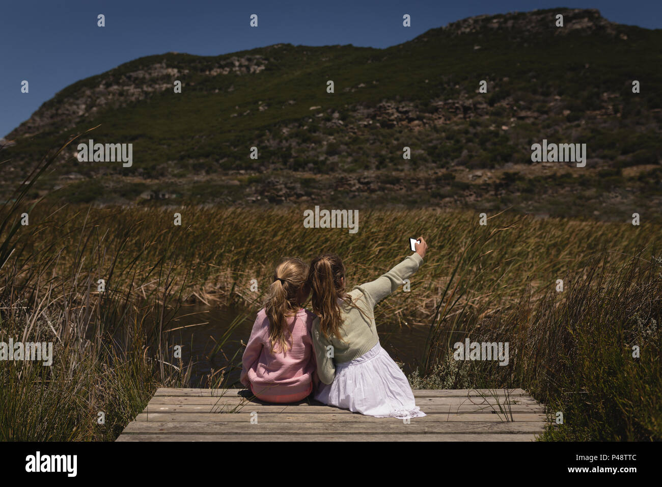 Child mobile phone rear view hi-res stock photography and images - Alamy