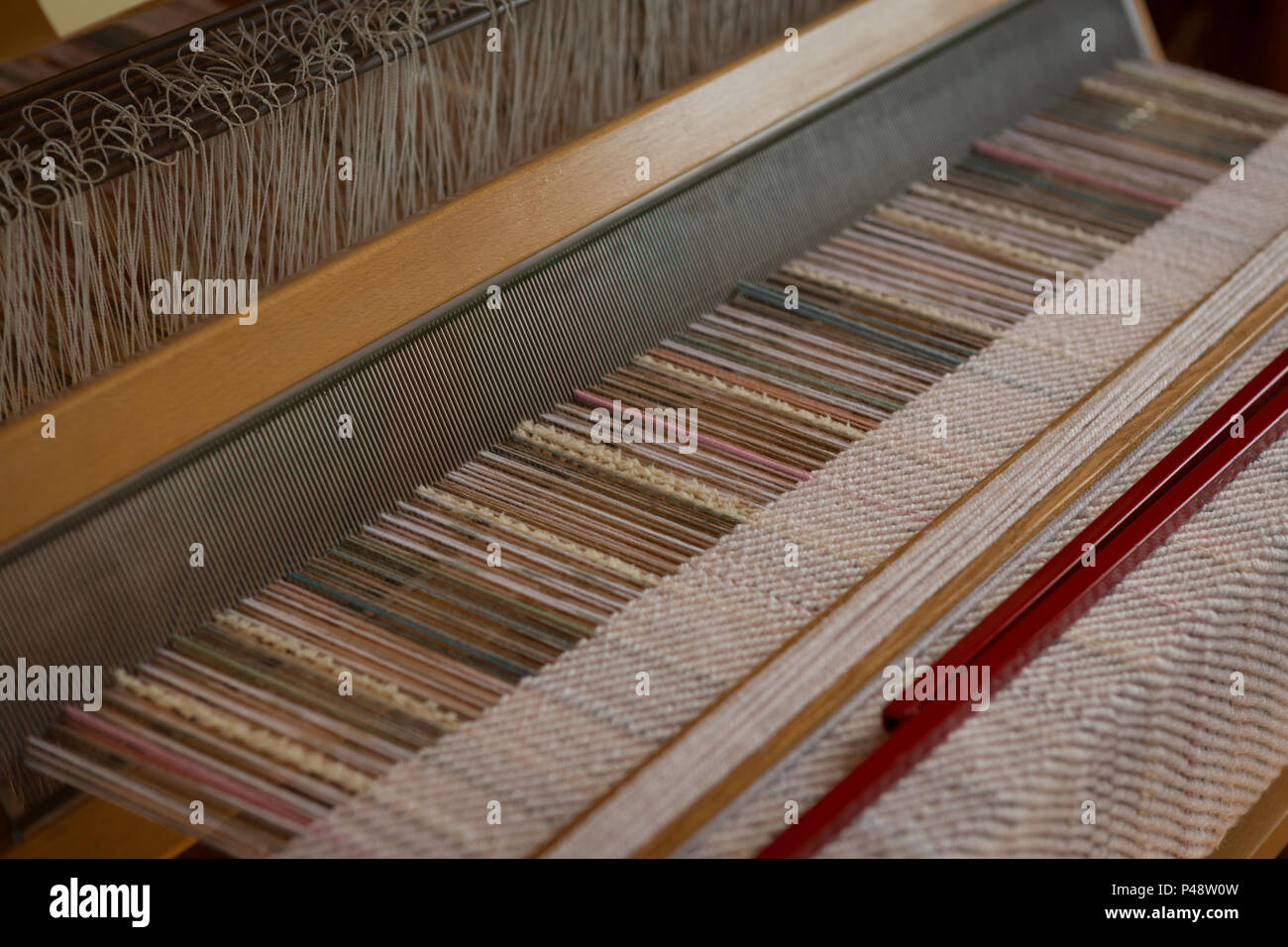 Machine with silk thread in factory Stock Photo - Alamy
