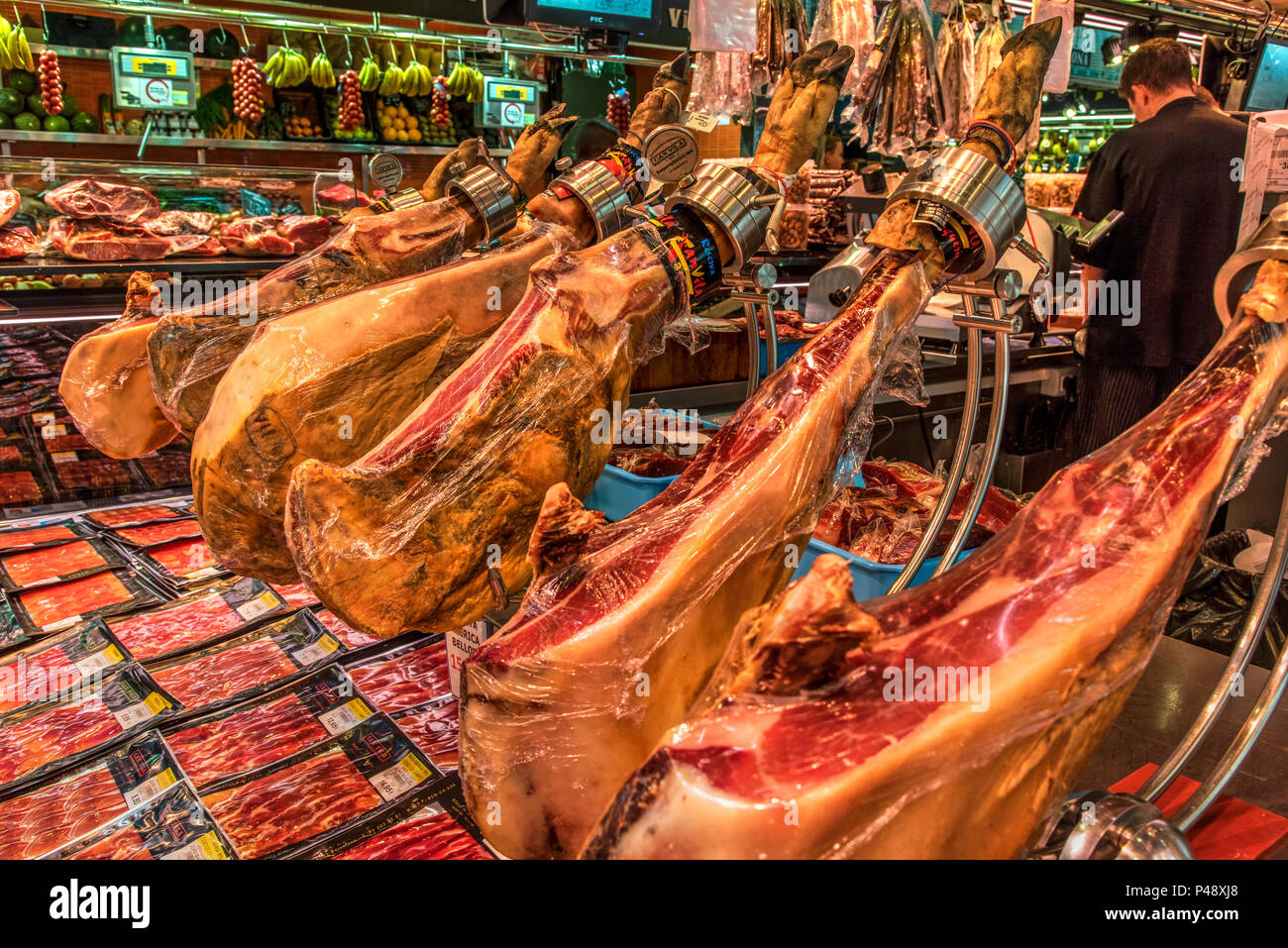 Stall selling typical Spanish hams, La Boqueria food market, Barcelona, Catalonia, Spain Stock Photo