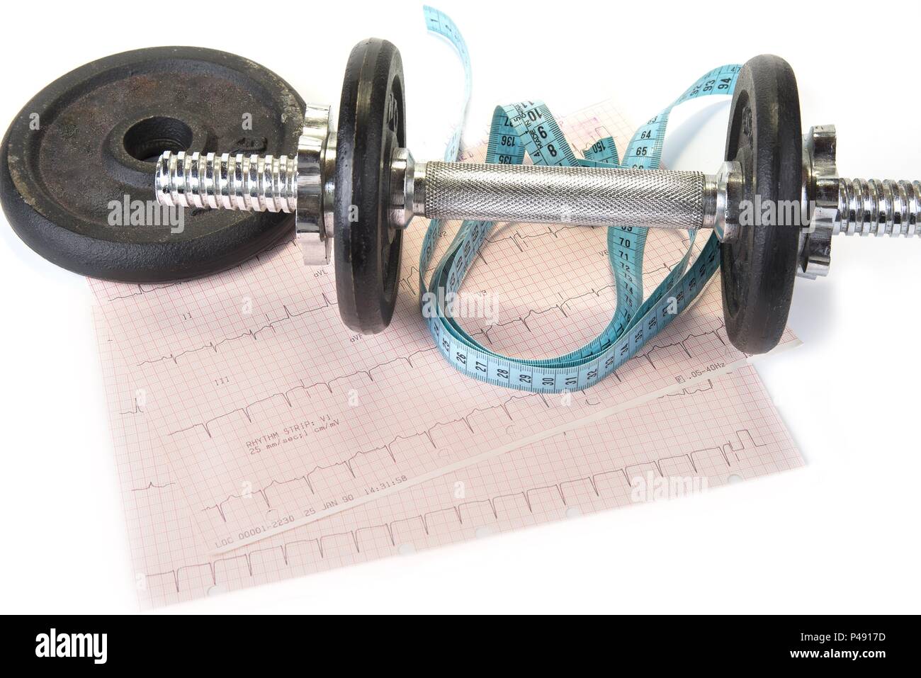 Dumbbells with measure tape and EKG graph. Healthy exercise make