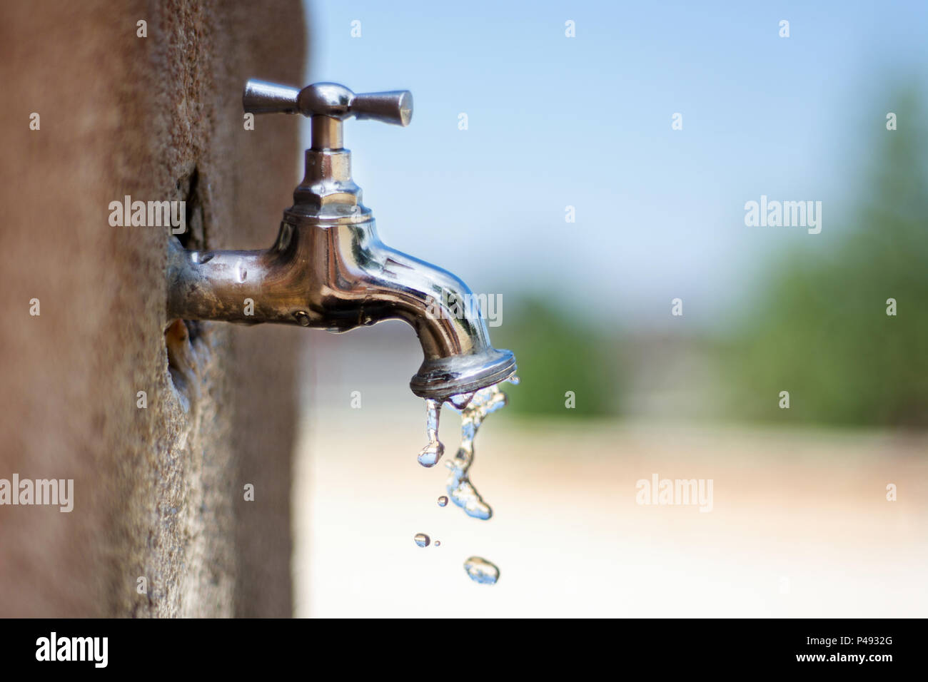 Faucet And Water Drops In Public Park Affected Of Global Warming