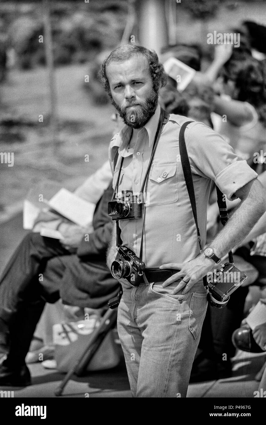 FORT SMITH, AR, USA - AUGUST 10, 1975 -- Pulitzer Prize photojournalist David Hume Kennerly prepares to cover a speech by President Gerald Ford at the new Vietnamese Refugee Center at Fort Chaffee, AR. Kennerly, who won a Pulitzer Prize for his photo coverage of the Vietnam War was made official White House photographer by Ford. Stock Photo