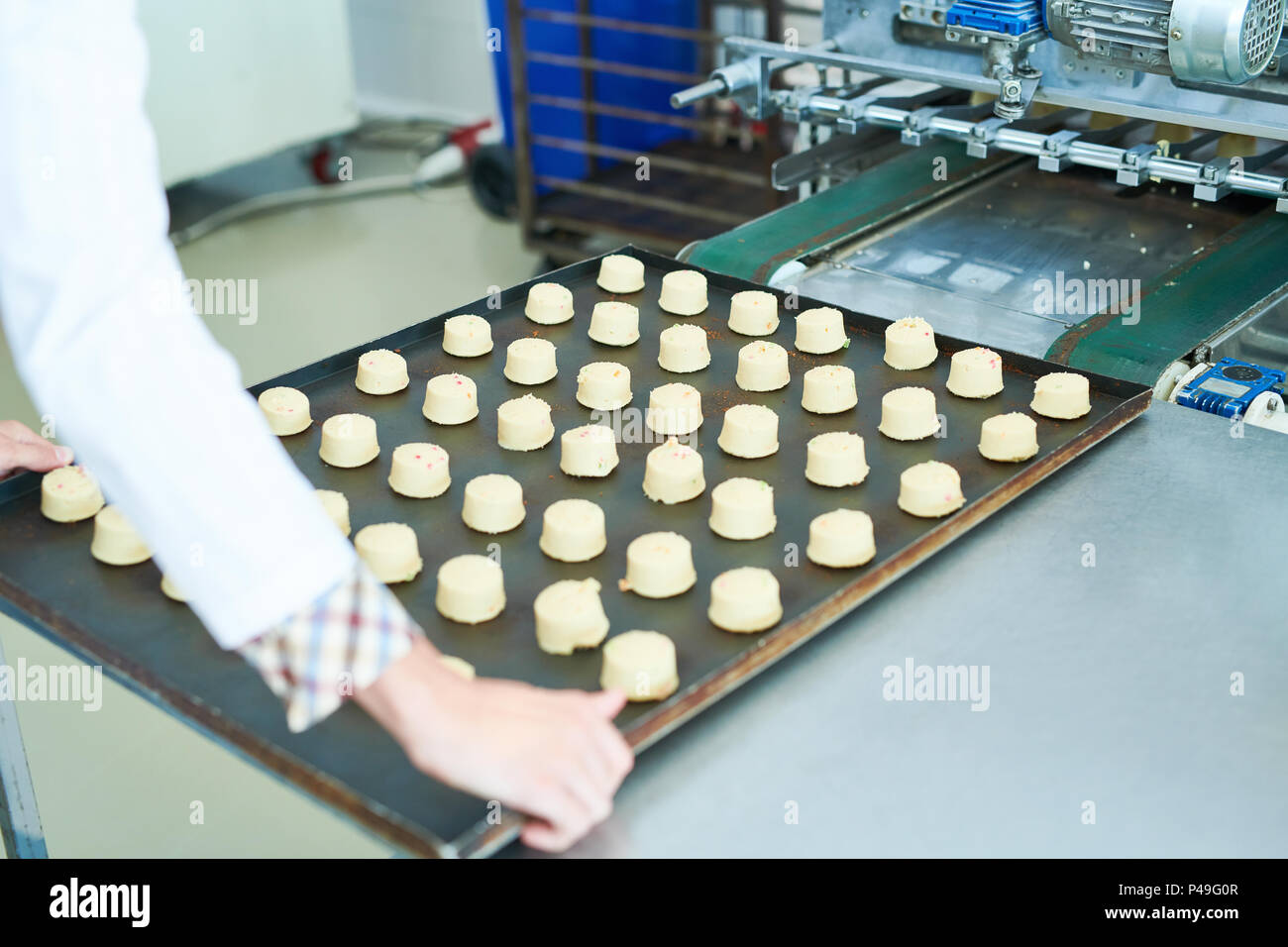 Confectioner holding spacing with pastries Stock Photo