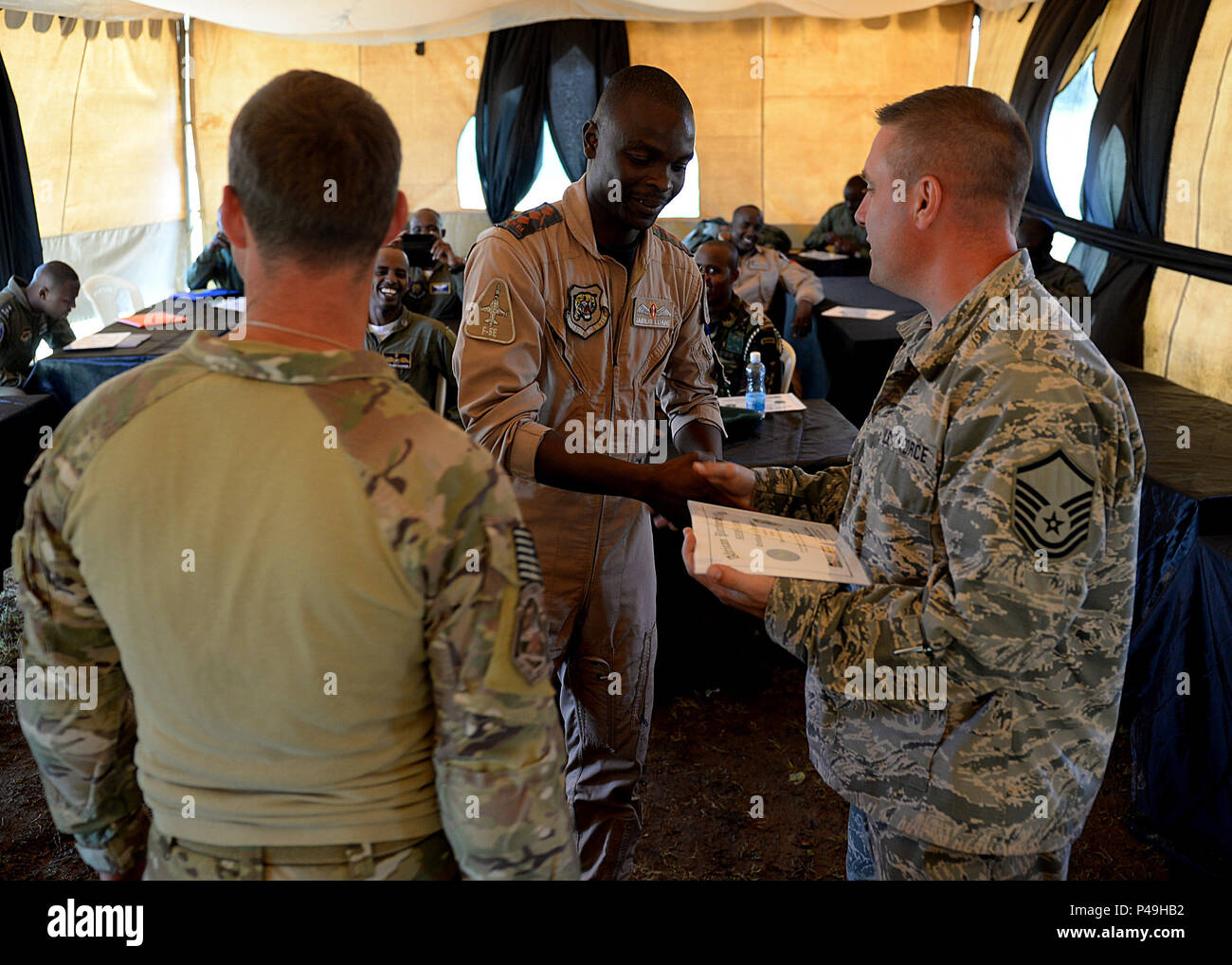 Usaf Apf A Kenyan Defense Force members receives a certification of completion ...