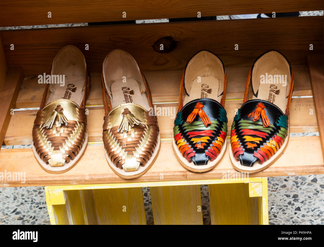 Take a risk balanced statistics Stylish Mexican women's sandals on sale at a boutique in San Miguel de  Allende Stock Photo - Alamy