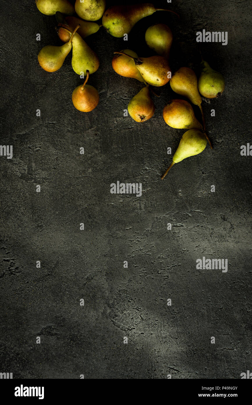 Organic Pears on Rustic Dark Background with Copy Space Stock Photo