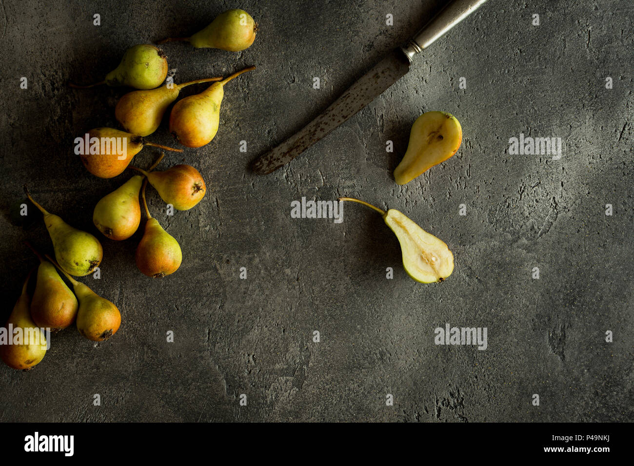 Organic Pears on Rustic Dark Background with Copy Space Stock Photo