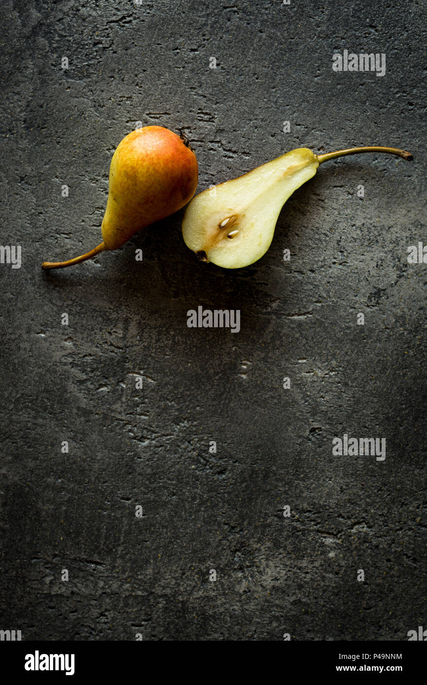 Organic Pears on Rustic Dark Background with Copy Space Stock Photo