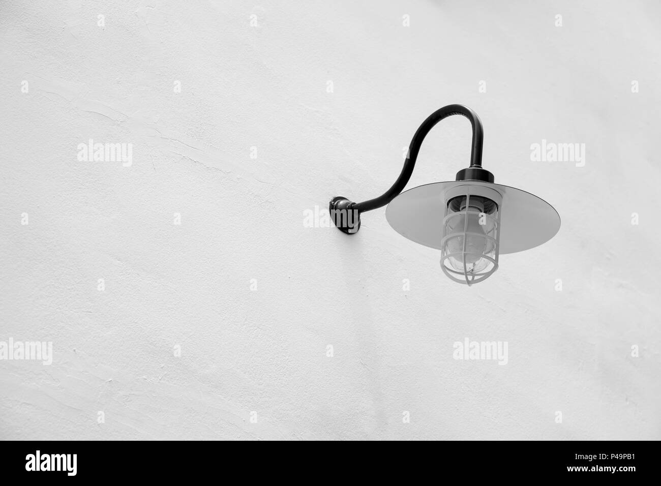 industrial street light decoration. white wall lighting vintage retro style in black and white with space for text. Stock Photo