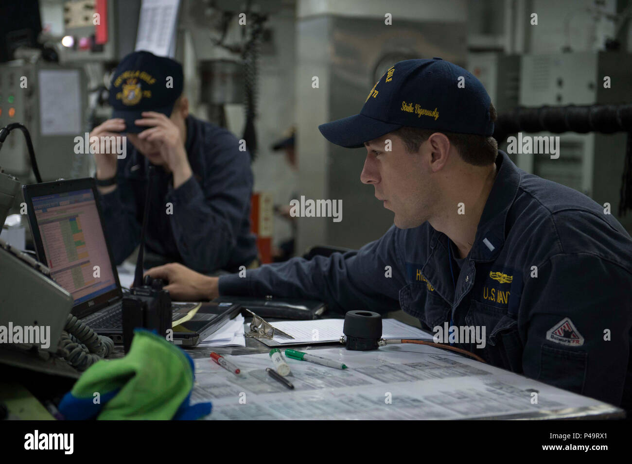 160614-N-HB733-056 NORFOLK, Va. (June 14, 2016) - Lt.j.g Joshua P.  Hildebrand,a Sailor aboard the Ticonderoga Class guided missile cruiser USS  Vella Gulf (CG 72), enters the results from the propulsion local control