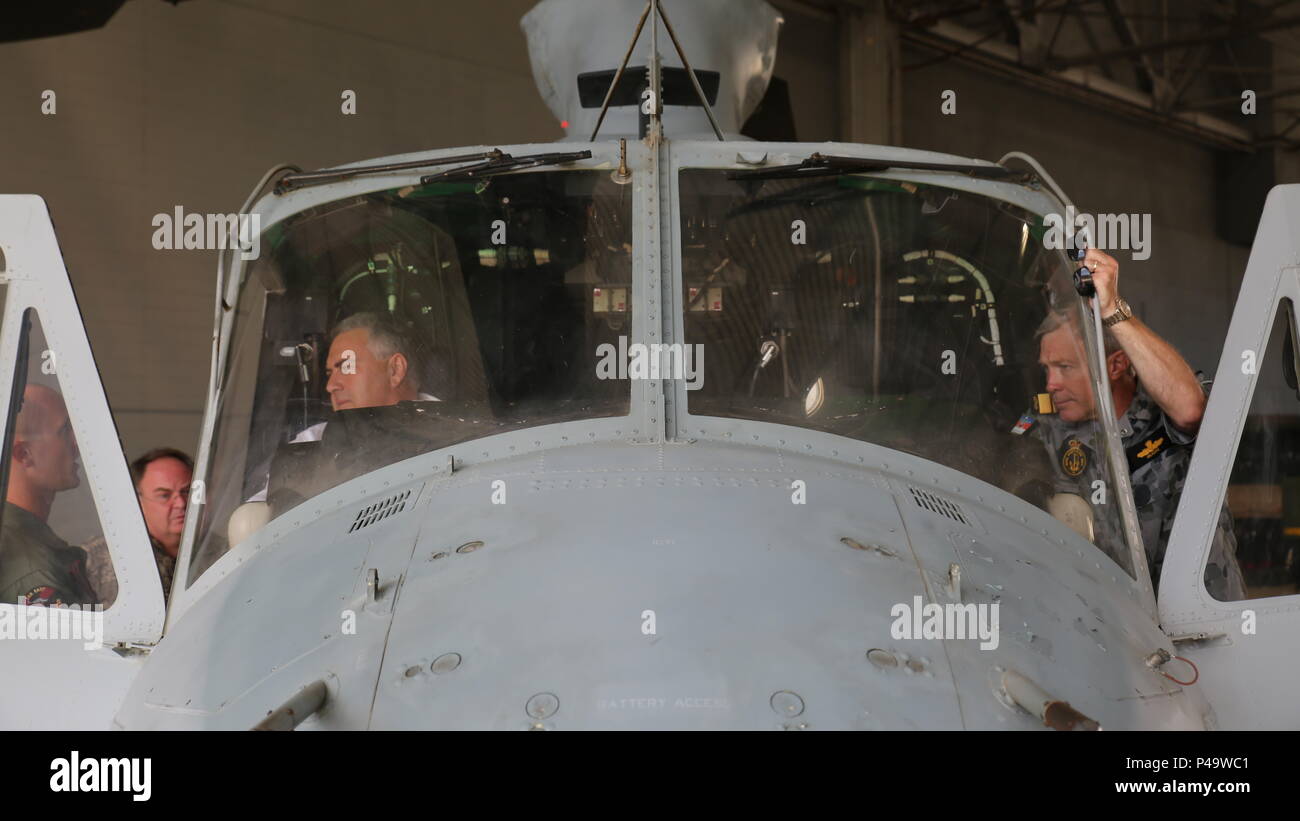 The Honorable Joe Hockey sits in the cockpit of a UH-1Y Venom helicopter as Marines from Marine Aircraft Group 24 explain the features of the aircraft at Marine Corps Air Station Kaneohe Bay, June 27, 2016.  Hockey is Australia’s ambassador to the U.S. During his visit, he discussed the importance of maintaining positive relationships between the two nations, with U.S. Marine leaders. (U.S. Marine Corps photo by Cpl. Jonathan E. LopezCruet) Stock Photo