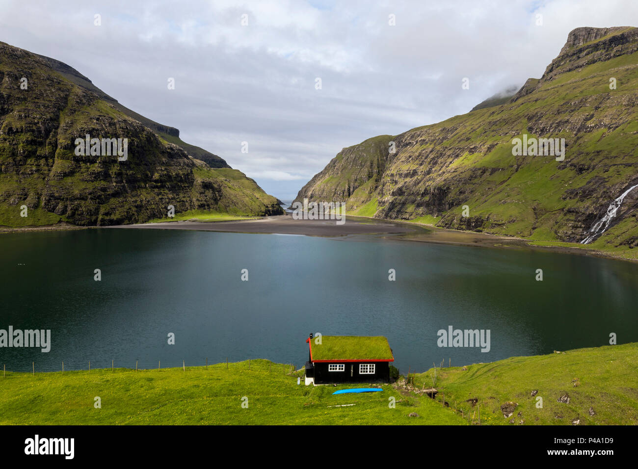 Grass roof house on sea shore, Saksun, Streymoy Island, Faroe Islands Stock Photo