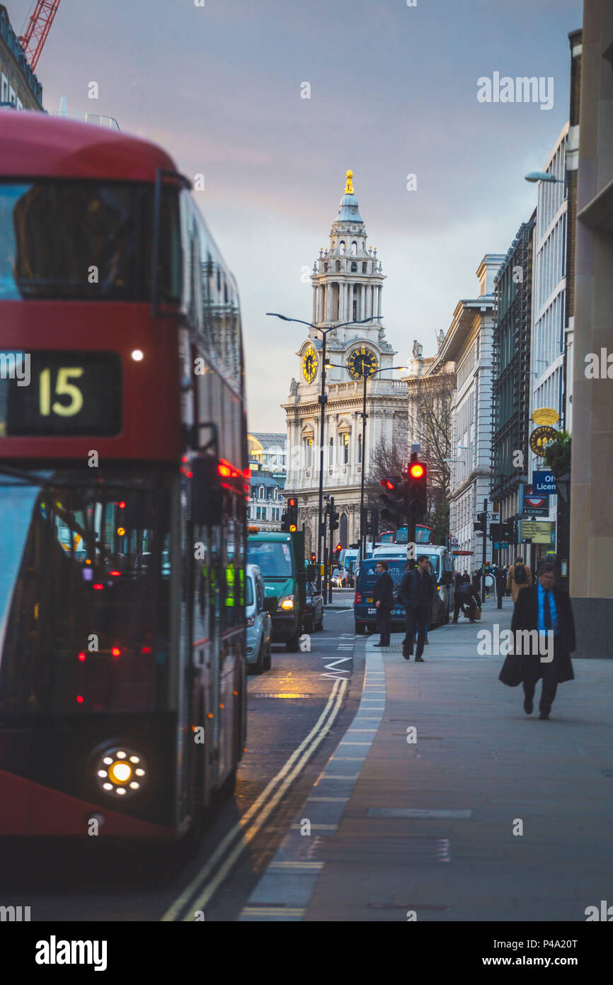 A detail of St Paul Cathedral with an iconic red bus on the foreground. London, United Kingdom. Stock Photo