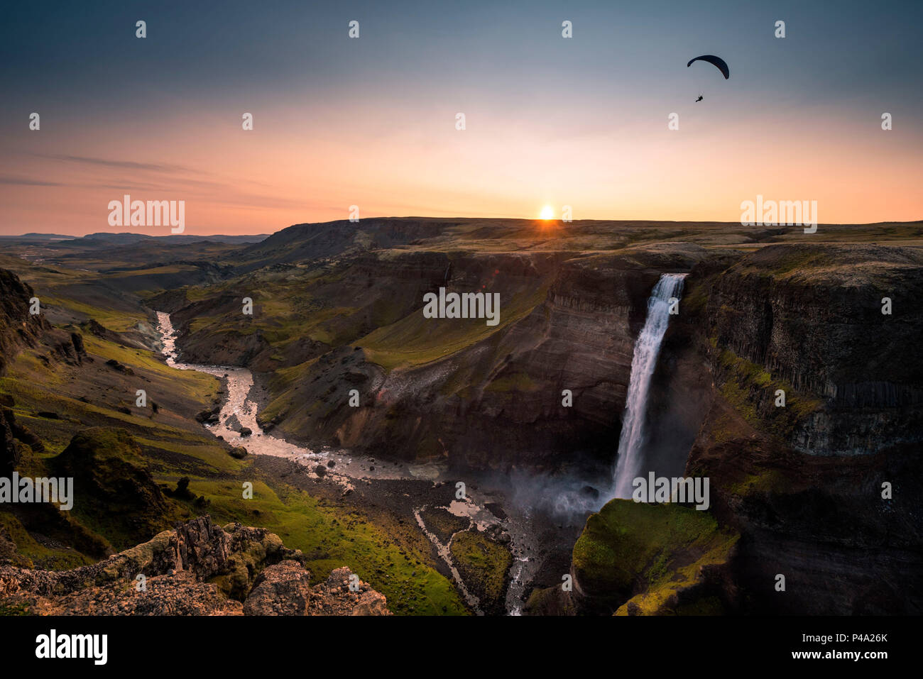 Paragliding over Haifoss waterfall at Fossa river at sunset, Southern Iceland, Iceland Stock Photo