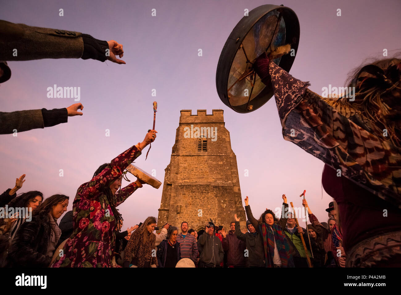 Somerset, UK. 21st June, 2018. Revellers gather on Glastonbury Tor for ...