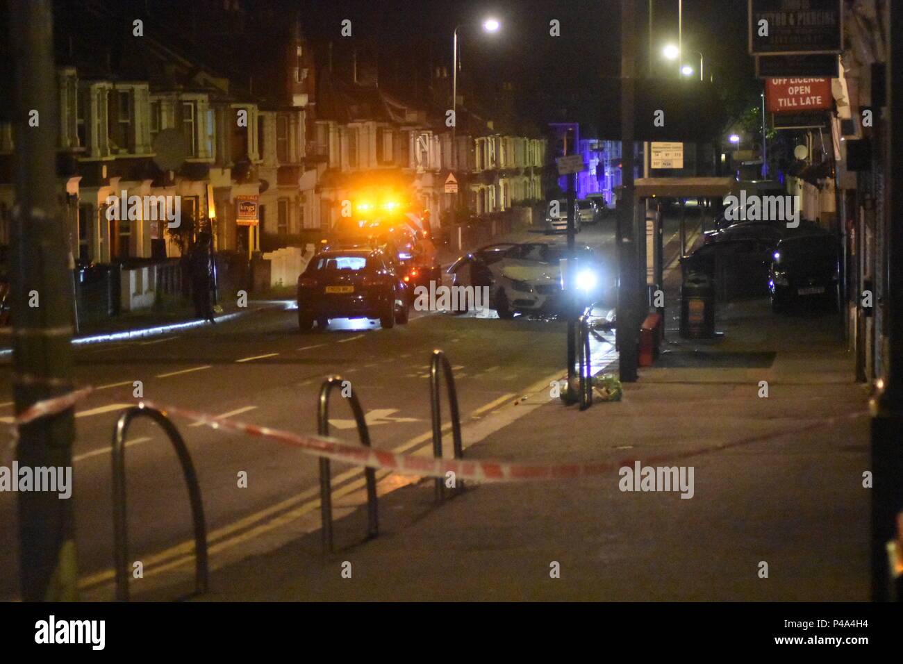 Walthamstow, London, UK. 21st June, 2018. A high speed collision leaves two cars devastated on a street in Walthamstow. There were no fatalities at the scene of the accident. It's apparent that the roof of one of the vehicles has been cut off with the jaws of life to remove a driver but no severe injuries were reported at this time. A tow truck removes one of the vehicles involved as the second waits to be removed also. Credit: Ricardo Maynard/Alamy Live News Stock Photo